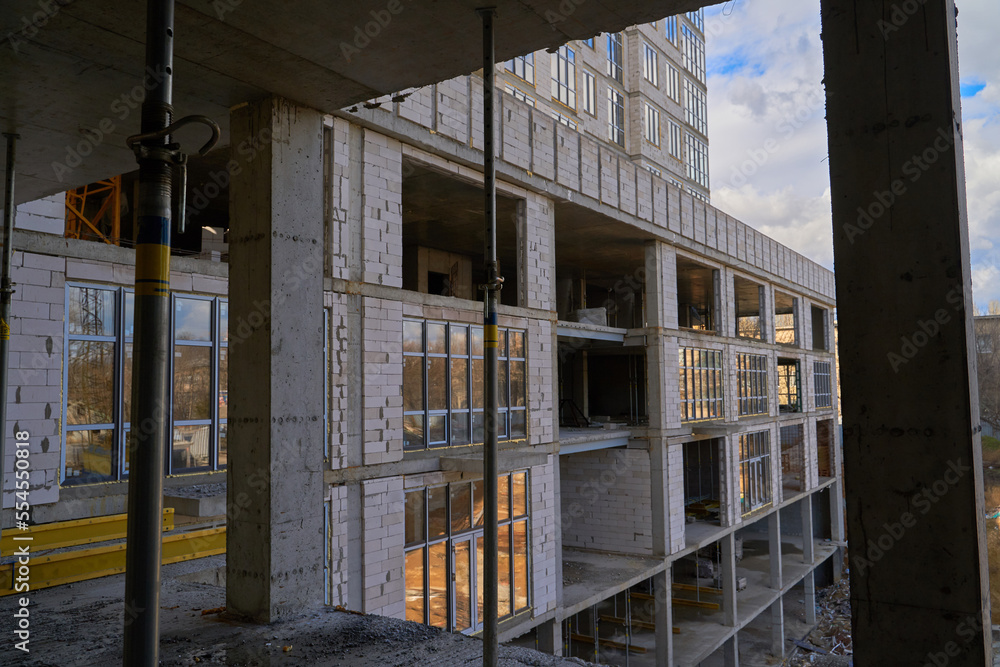 Obraz premium Construction site. High rise Building under construction. Construction of high-rise residential building
