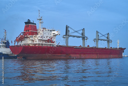 bulk carrier vessel is sailing in the port area.