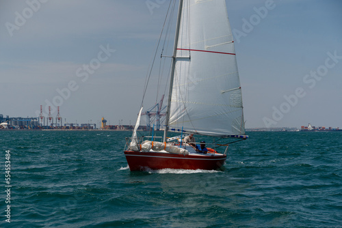 Sailing. Yacht ship with white sails in open sea. Luxury boats.. Yachting. Luxury Yachts.