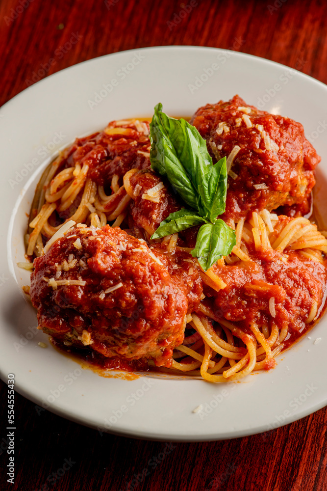 Spaghetti and meatballs. Pasta with homemade meatballs, Parmesan cheese and Italian parsley. Classic American or Italian restaurant favorite. Homemade pasta with tomato sauce, meats and cheeses. Spaghetti and meatballs. Pasta with homemade meatballs, Parmesan cheese and Italian parsley. Classic American or Italian restaurant favorite. Homemade pasta with tomato sauce, meats and cheeses.