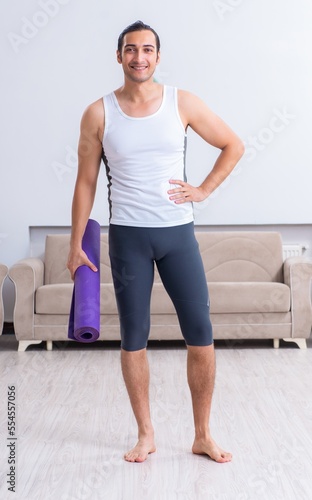 Young man training and exercising at home