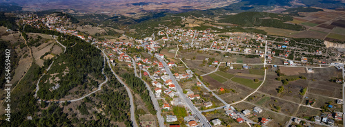 Aerial view of the village Domokos in Greece on a sunny day . © GDMpro S.R.O