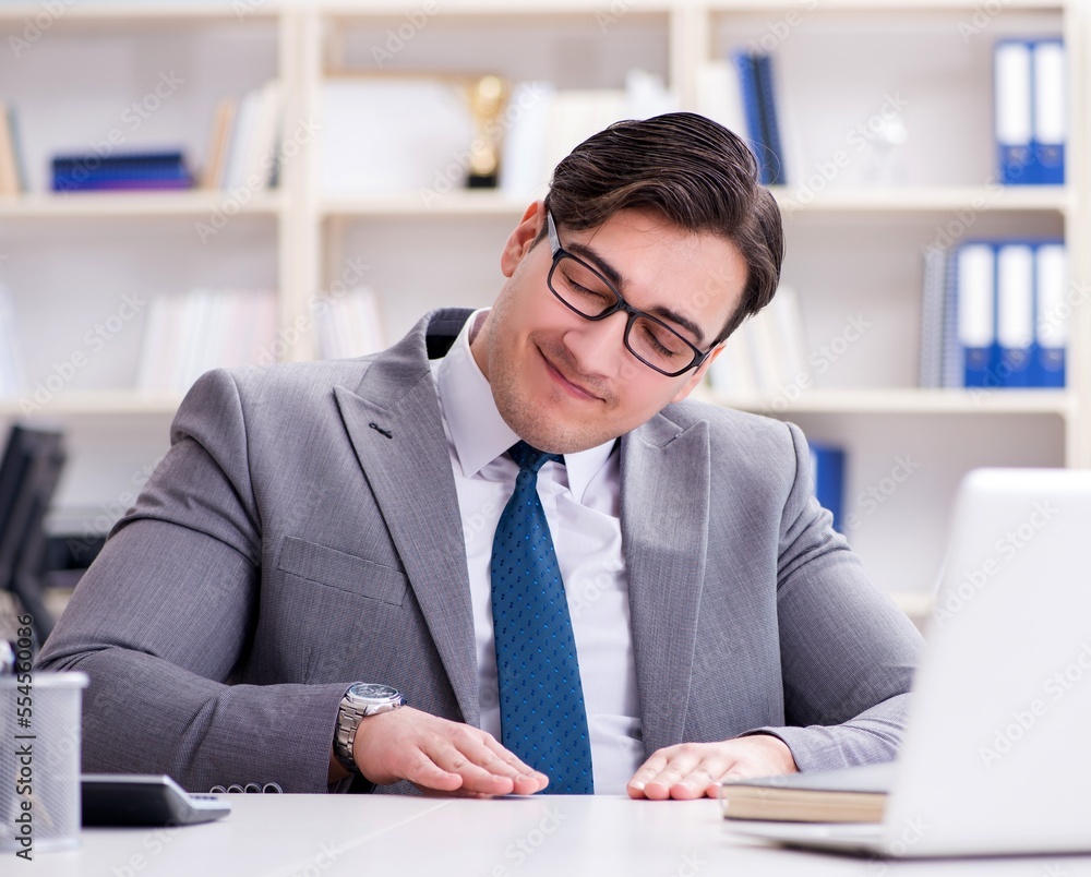 Businessman playing drums in office Businessman playing drums in office