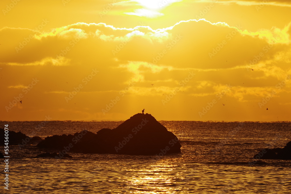 Landscape photo of golden dawn on the sea