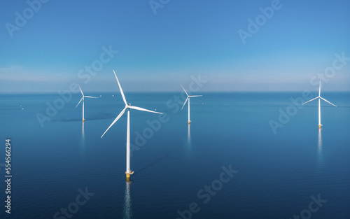 Drone view from above at Windmill park with windmill turbines in the Netherlands aerial view of wind energy park photo