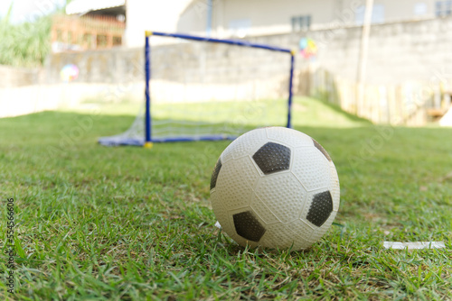 soccer ball on the grass focus on foreground © capplebkk