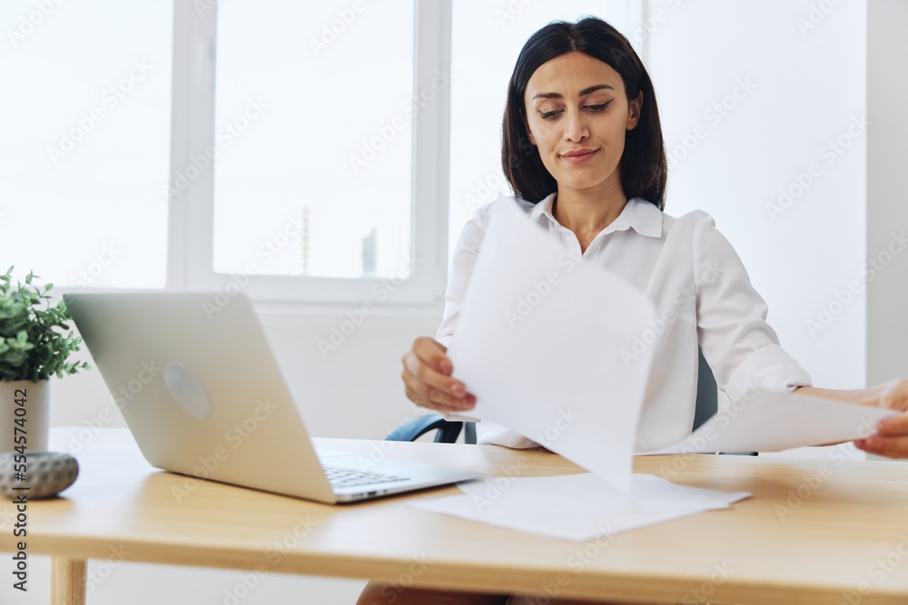 Woman business working at her laptop at home in her office, freelance employee in business, happiness of working online, technology in business Woman business working at her laptop at home in her office, freelance employee in business, happiness of working online, technology in business