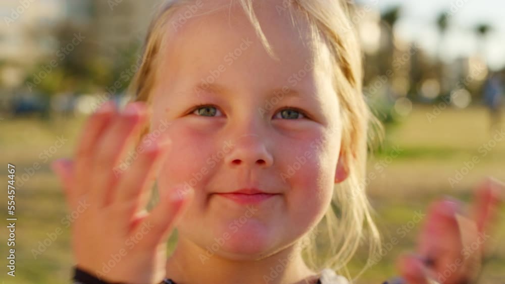 Child, nature and hands on face putting hair to the back while outdoor at a park for fun, play and freedom in summer. Portrait of a cute girl kid with a innocent smile while on Holiday in Sweden Child, nature and hands on face putting hair to the back while outdoor at a park for fun, play and freedom in summer. Portrait of a cute girl kid with a innocent smile while on Holiday in Sweden