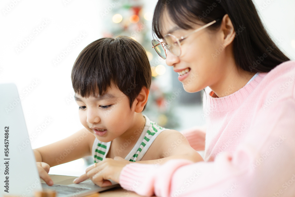Asian little lovely boy learning or studying at home with his mother. Asian little lovely boy learning or studying at home with his mother.