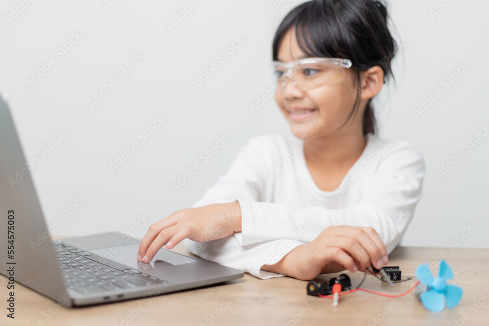 Asia students learn at home in coding robot cars and electronic board cables in STEM, STEAM, mathematics engineering science technology computer code in robotics for kids concept. Asia students learn at home in coding robot cars and electronic board cables in STEM, STEAM, mathematics engineering science technology computer code in robotics for kids concept.