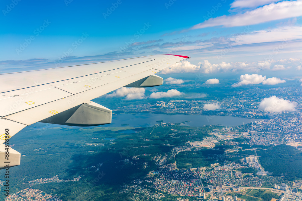 View from the airplane window during taking off on a clear summer morning. Yekaterinburg, Russia View from the airplane window during taking off on a clear summer morning. Yekaterinburg, Russia