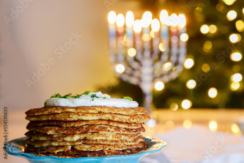 It is a traditional Jewish food dish to serve crispy potato latkes during Hanukkah.