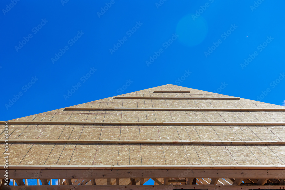 Home framing with roof view for new residential construction. Home framing with roof view for new residential construction.