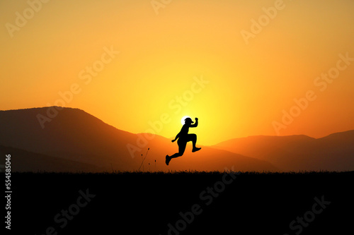 silhouette of a person running on the sunset