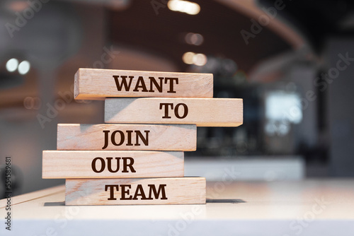 Wooden blocks with words 'WANT TO JOIN OUR TEAM'.