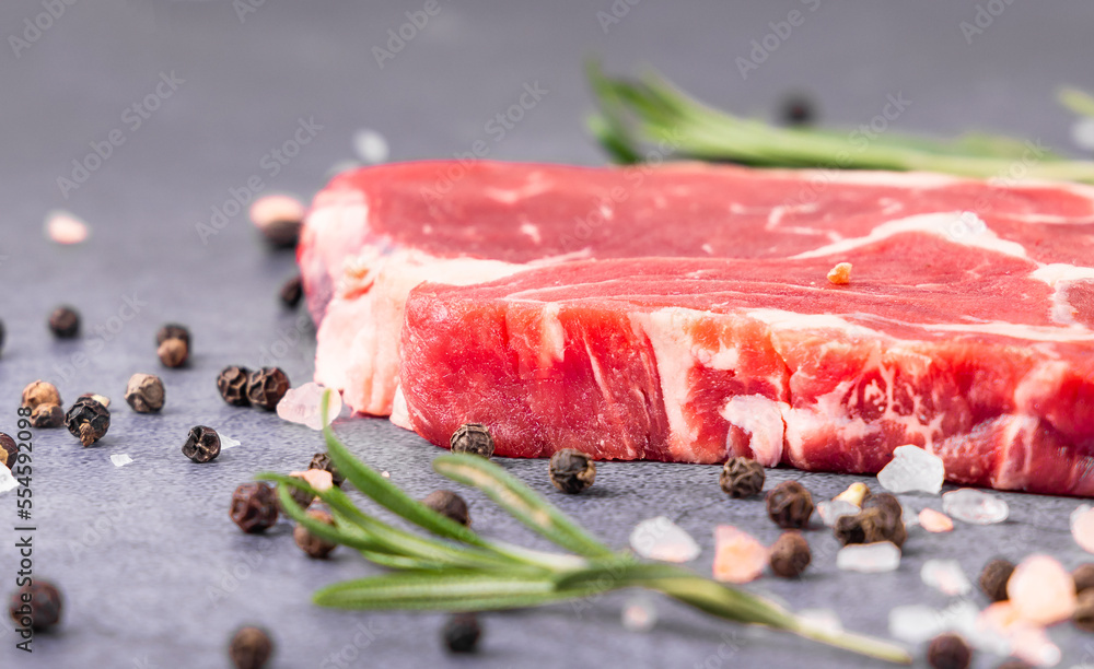 Fresh beef steak on a concrete background