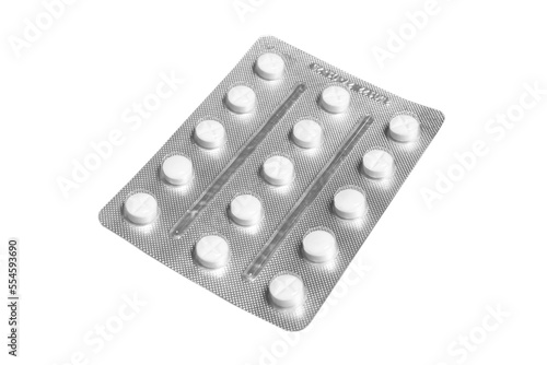 Macro shot pile of tablets pill in silver blister packaging isolated on white background. Aluminium foil blister pack. Pharmacy products. Medicine pills and drugs close up. Pills background