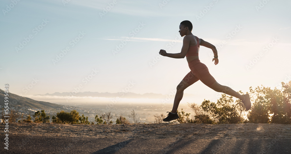 Black woman, fitness and running on mountain during sunset for