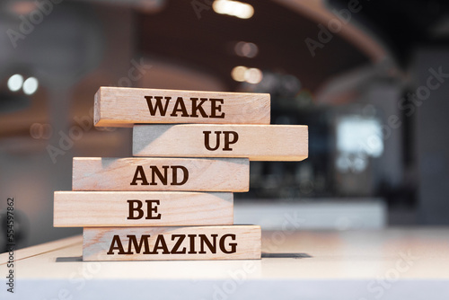 Wooden blocks with words 'Wake Up and Be Amazing'.