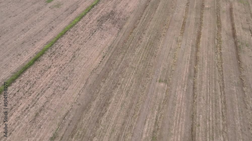 Drone flying over ploughed land Drone flying over ploughed land