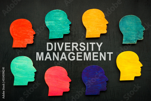 Diversity management sign and colorful heads around.