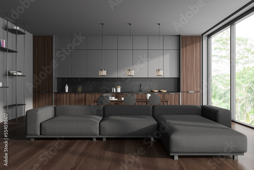 Grey stylish studio interior with relaxing and eating area near panoramic window