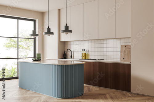 Light kitchen interior with bar countertop and kitchenware, panoramic window