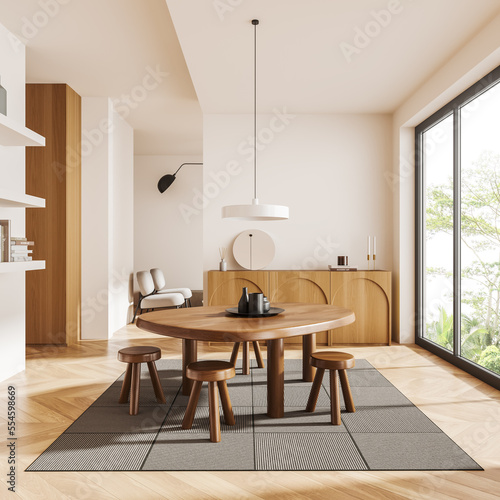 Light living room interior with dining table and drawer, panoramic window