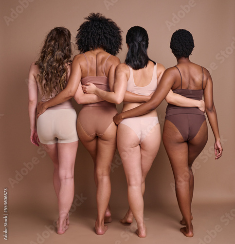 Papier peint Back, diversity and body positivity with woman friends in studio on a brown background for natural confidence