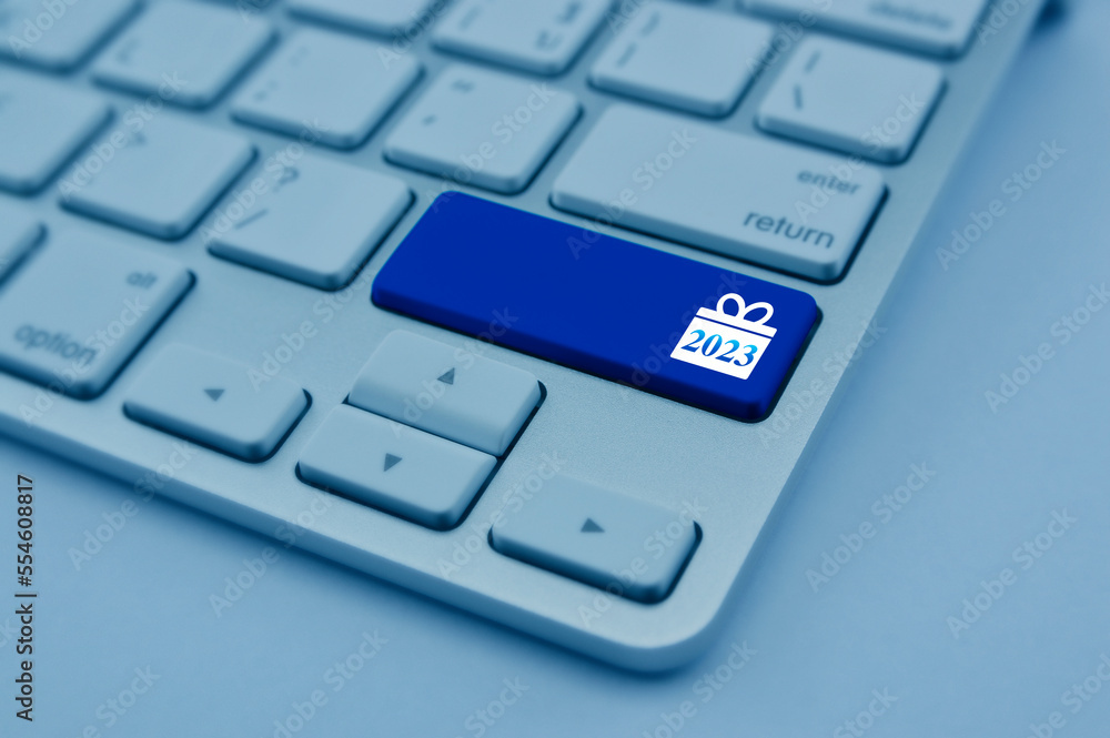 Gift box happy new year 2023 flat icon on modern computer keyboard button, blue tone, Business shop online concept Gift box happy new year 2023 flat icon on modern computer keyboard button, blue tone, Business shop online concept