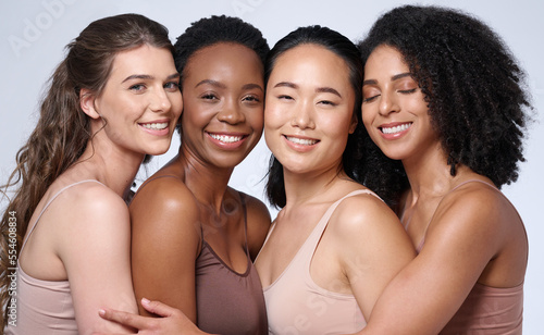 Face portrait, beauty and group of women in studio on gray background. Cosmetics, makeup and diversity of female models with glowing and flawless skin after spa facial treatment posing for skincare.