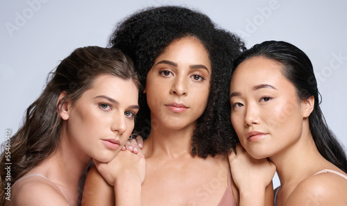 Skincare, beauty and diversity of women for makeup marketing, dermatology wellness and cosmetics against a grey studio background. Spa, support and face portrait of the skin of model friends