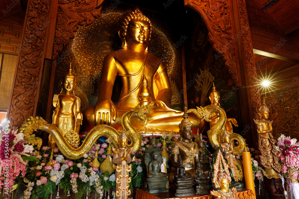 Phu Ruea District, Loei Province, Thailand - 28 July 2022: Golden big buddha meditating in church at Wat Somdet Phu Ruea Ming Mueang