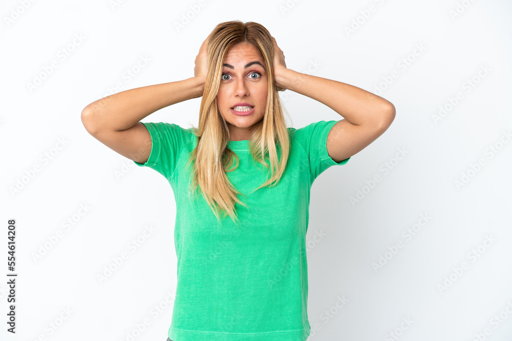Blonde Uruguayan girl isolated on white background doing nervous gesture Blonde Uruguayan girl isolated on white background doing nervous gesture