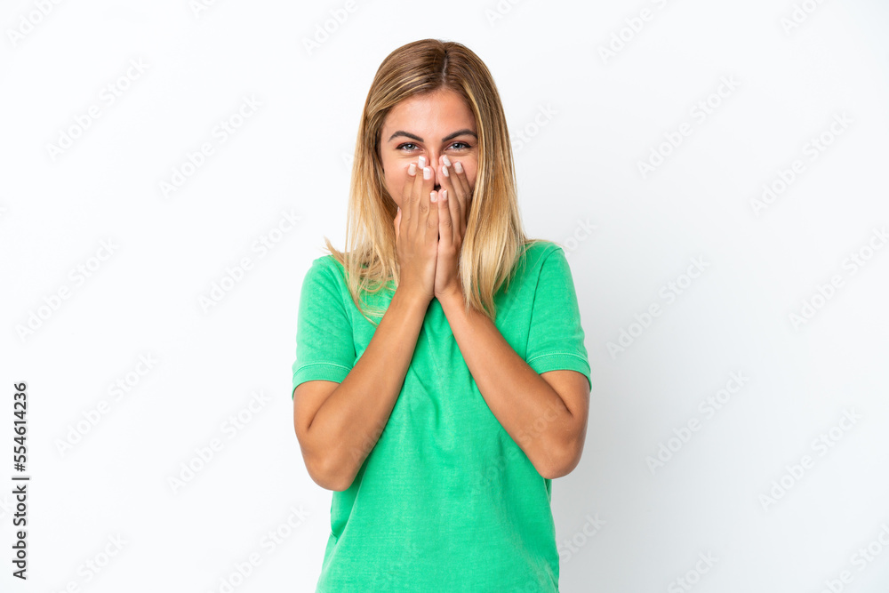 Blonde Uruguayan girl isolated on white background happy and smiling covering mouth with hands Blonde Uruguayan girl isolated on white background happy and smiling covering mouth with hands