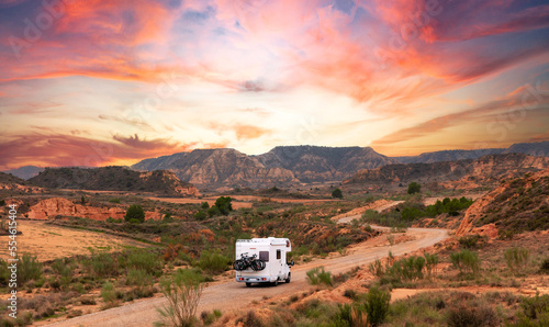Quadro em tela Motor home on the road at sunset- travel,  adventure,  road trip concept