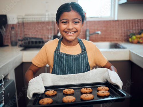 Quadro em tela Girl kid, cookies and baking with portrait and bakery skill, learning and development with success and pride