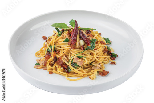 Png Spaghetti with bacon, dried chillies and Thai herbs on a white plate