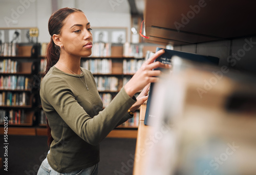 Search, books and education with woman in library for learning, college and scholarship study. Knowledge, school and literature with university student by bookshelf for academy, information and goal