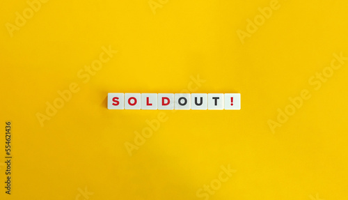 Sold Out. Block Letter Tiles on Yellow Background. Minimal Aesthetics.