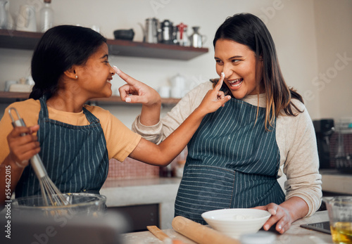 Mother, girl and cooking while playing with flour, having fun or bonding. Learning, education and happy child chef with caring mom baking pastry, smiling and enjoying time together with dough on nose