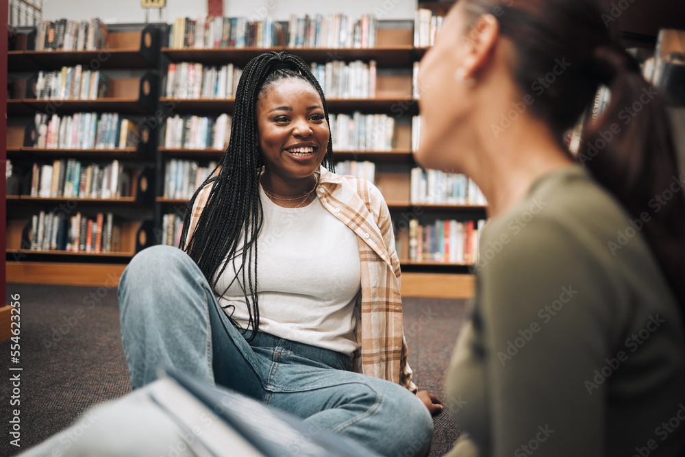 University, students and friends on library floor for studying, education and learning together. Happy black girl, gen z youth and college student at academy, campus and school in room with bookshelf - obrazy, fototapety, plakaty 