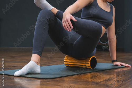 Obraz na plátně Myofascial release,Massaging fascia calf muscles with myofascial roll,fitness,self-care,health,smart fitness