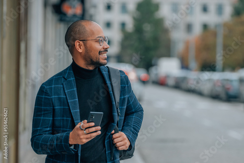 businessman on the street with mobile phone