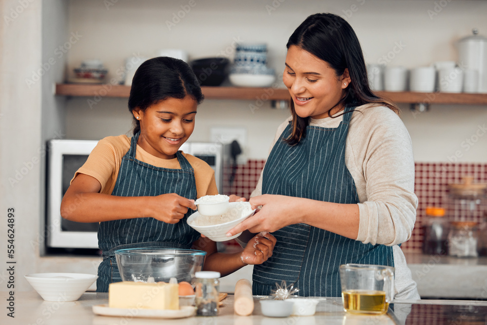 Learning, family and cooking cake with mother for bonding, wellness and help with smile. Happy family, kitchen and mom teaching young daughter baking skill with flour measurement in home. Learning, family and cooking cake with mother for bonding, wellness and help with smile. Happy family, kitchen and mom teaching young daughter baking skill with flour measurement in home.