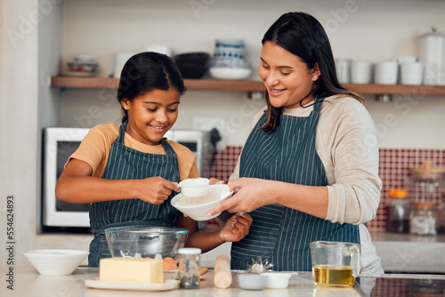 Obraz na plátne Learning, family and cooking cake with mother for bonding, wellness and help with smile