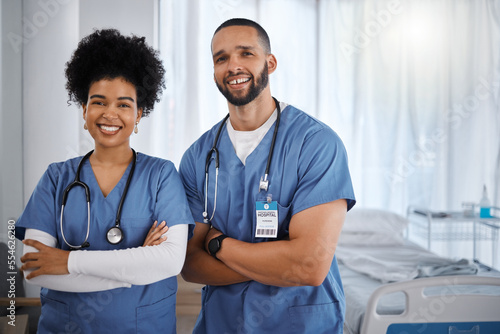 Doctor, portrait smile and arms crossed at hospital with vision for healthcare, phd or cardiology team. Happy medical experts standing in confidence for teamwork, health checkup or medicare at clinic photo
