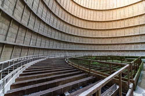 Inside a cooling tower of a nuclear power plant. Green overgrown. abandoned place