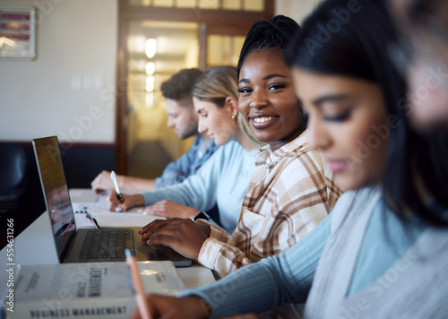 Black woman, student and smile with laptop for education, learning or university scholarship in class. Portrait of African American female learner smiling with computer for academic research or study
