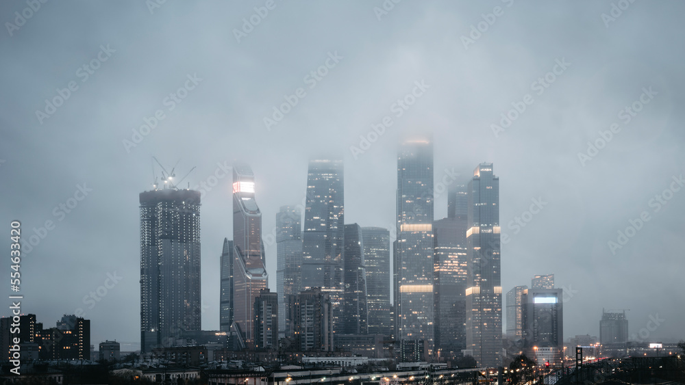 View of the skyscrapers in the evening in the fog